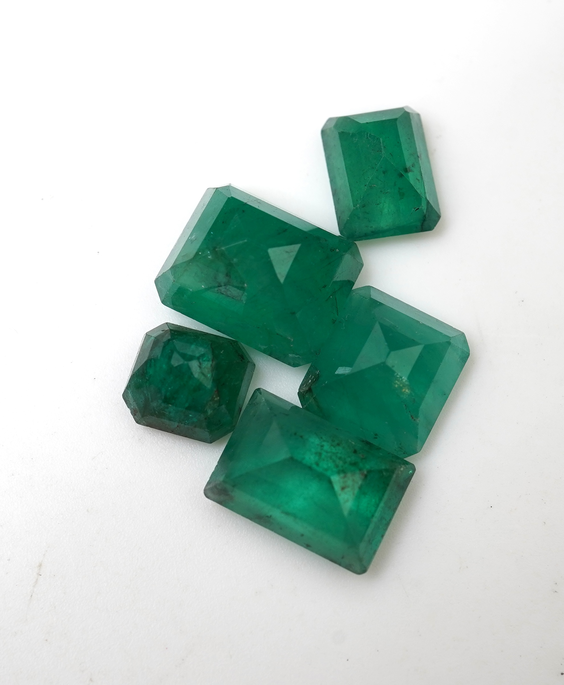 A collection of loose emeralds